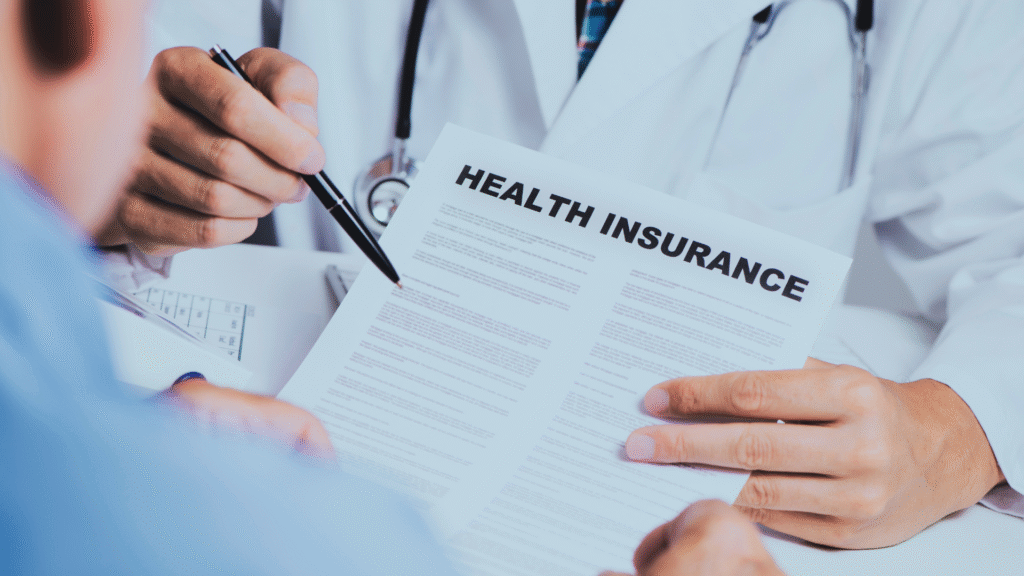 A doctor holding a health insurance document with a patient, discussing coverage details.