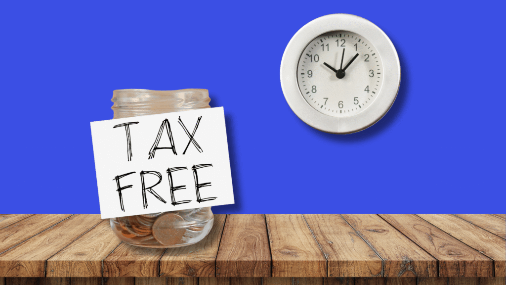 Image of a jar with a "Tax Free" label and coins on a wooden table, paired with a clock against a blue background, emphasizing tax-free savings.